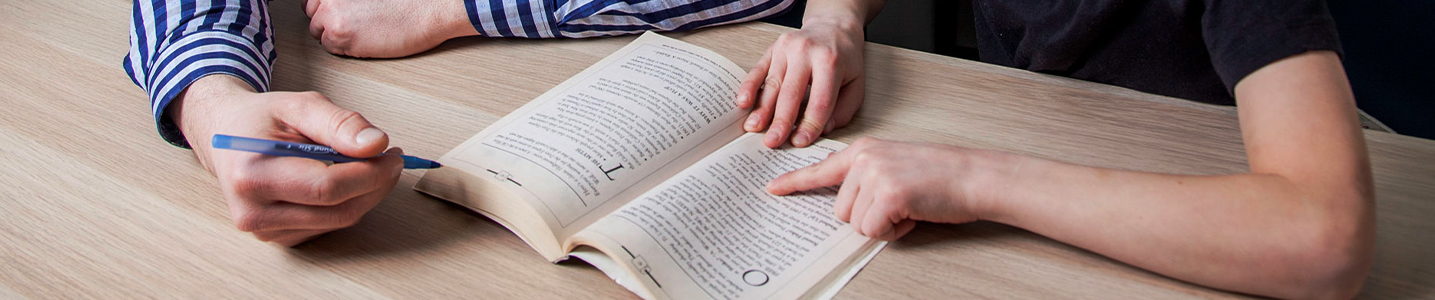 finger following reading in book